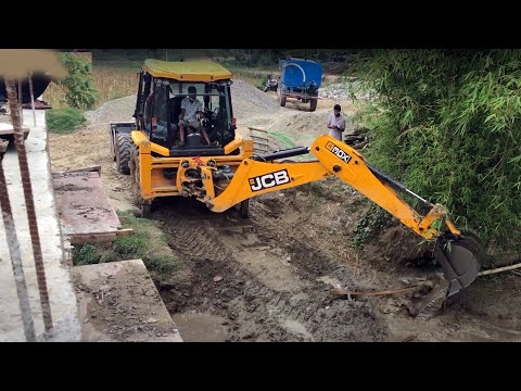 JCB Throwing Water, JCB Backhoe 3DX Machine Working Bridge Construction