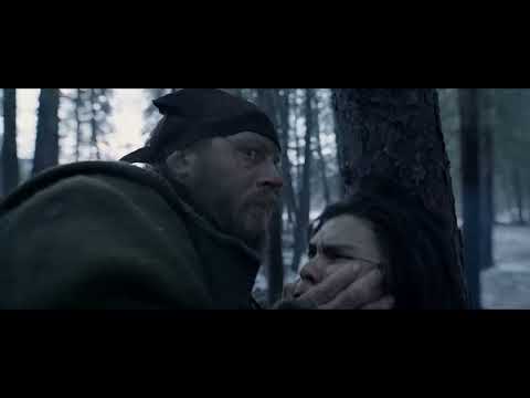The Revenant official trailer still: Hugh Glass (Leonardo DiCaprio) against a frozen river and grey sky