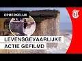 Toerist maakt foto op klifrand