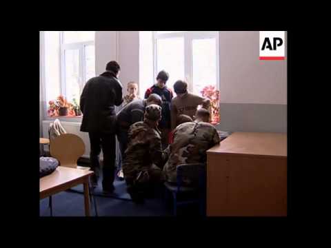 US Troops teach Serb and Albanian children English