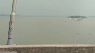 preview picture of video 'সৈয়দ নজরুল ইসলাম সেতু থেকে, মেঘনা নদী ও অাশুগঞ্জ ফেরিঘাট'