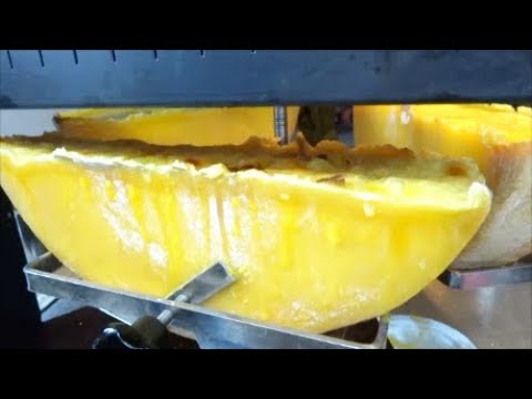 LONDON STREET FOOD, BOROUGH MARKET, SWISS RACLETTE, MELTED CHEESE OVER BOILED POTATOES