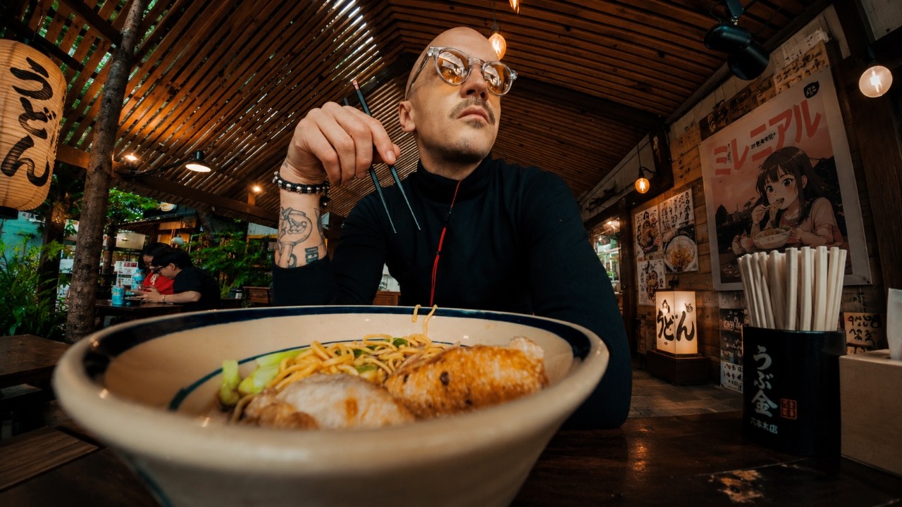 Elder Tattooed Millennial Eating Udon Under Groovy Electric Guitar | 4K 25 FPS