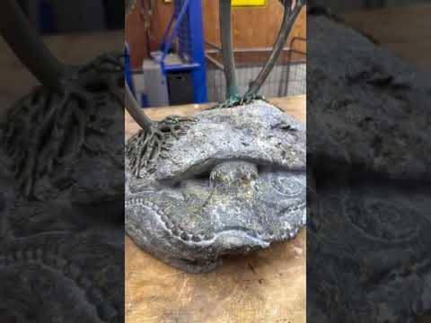 “Denizens” is a tide pool ecosystem out of wood metal and stone.