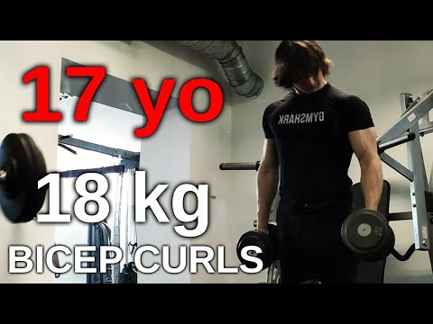 17 years old bodybuilder curls 18 kg dumbells for reps