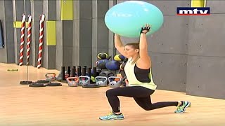 Full body workout using a Swiss ball and a pair of dumbbells