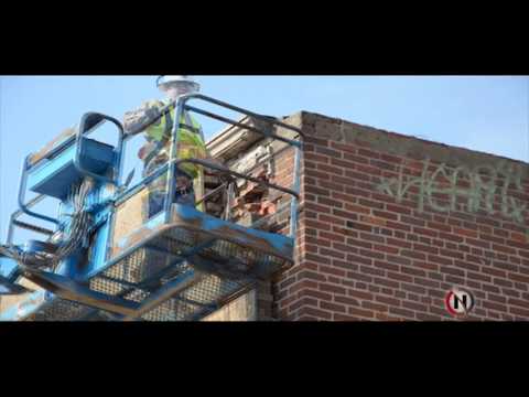 Material on building at 222 S. Main Street secured