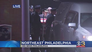 Officers transporting Chris Fitzgerald's casket for funeral Mass