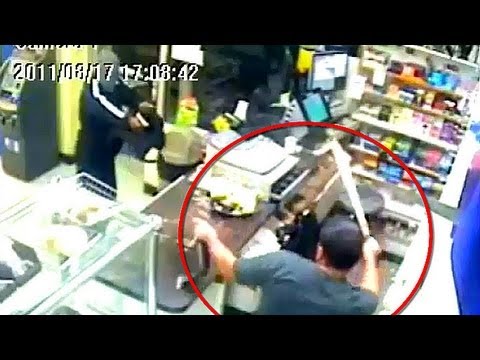 Deli clerk pulls machete on masked man in robbery attempt [REAL FOOTAGE]