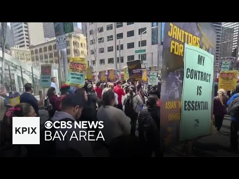 Janitors, hotel workers join May Day march together for better pay and conditions