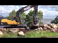 Caterpillar Truck In Action Moving Stones And Digging