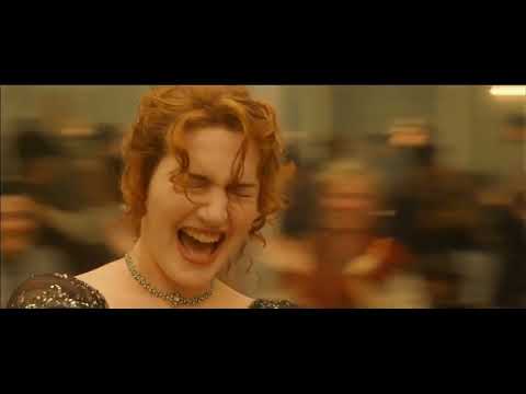 Official trailer still: Jack and Rose at the bow as the love theme swells across open ocean