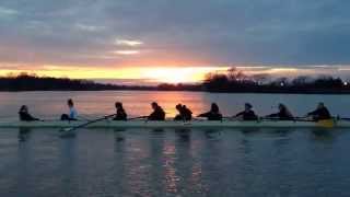 Novice girls rowing across a pretty sunset tonight.