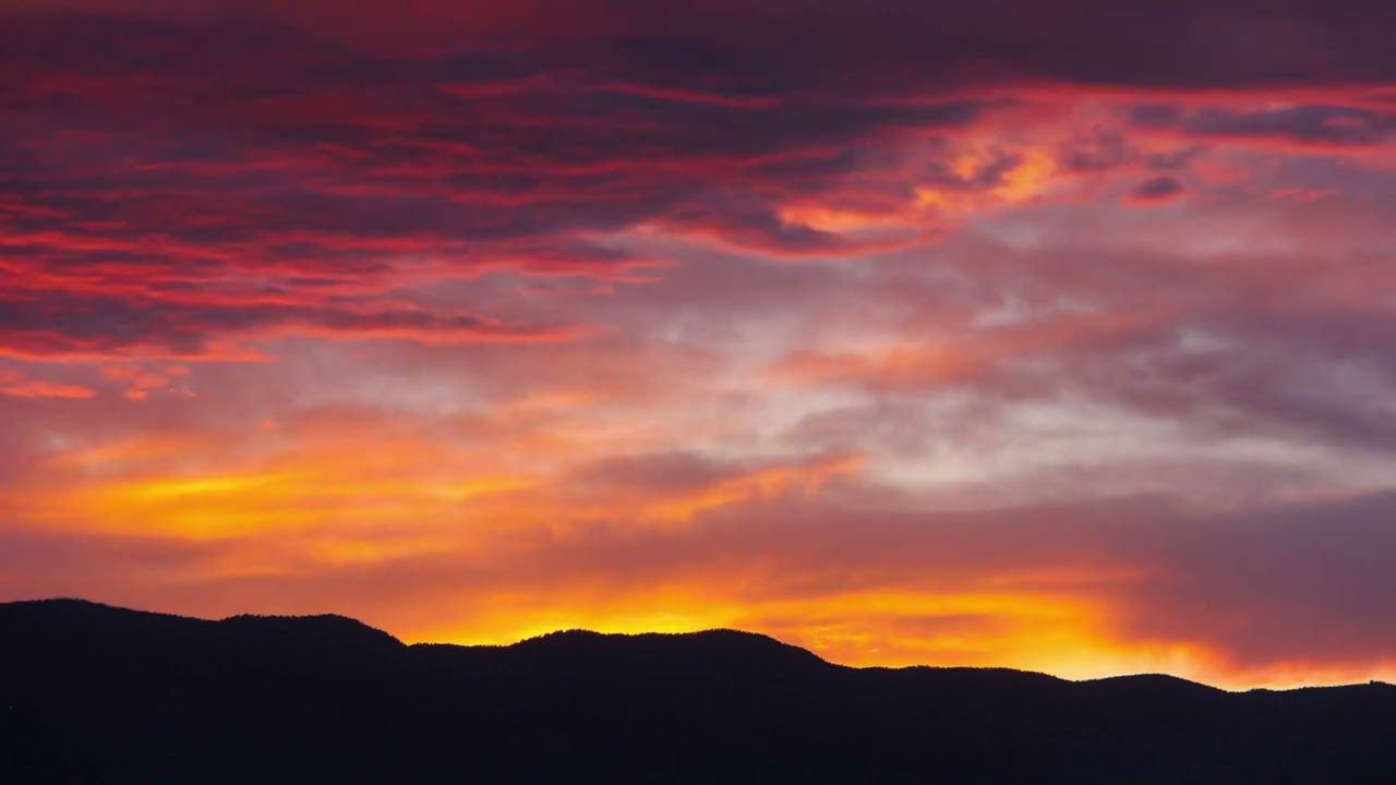 Mountain Range Landscape Silhouette Under Beautiful Cloud Red Sunset Or Sunrise Sky Background Loop
