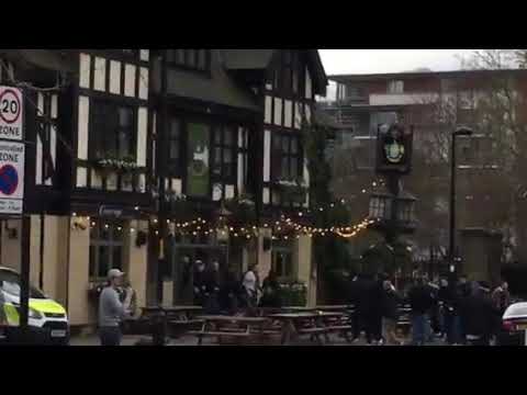 Trouble erupts as Leeds hooligans armed with pick axe try to att×ck West ham boys outside Leeds pub