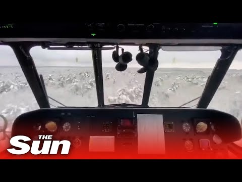 Watch incredible moment Ukrainian Mi-17 attack helicopter swoops just metres from snowy forest
