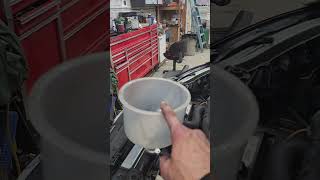 Bleeding the coolant system on a Subaru.