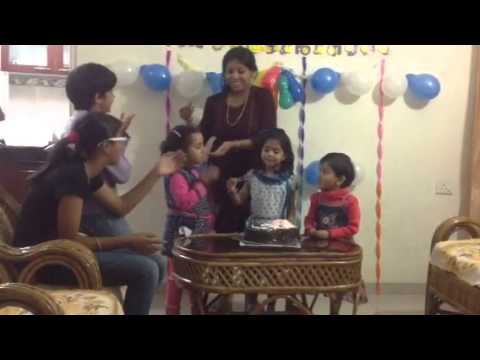 Jiya cutting cake on her fourth birthday