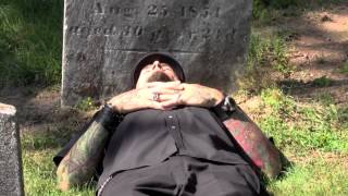 Mark Sinnis by chance lying on the grave of Mary Ann Slauson who died on his birthday