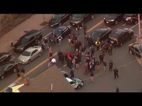 Police: 2 in custody after shots fired at officers in Boston