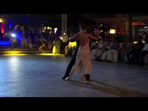  Natalia Hassan  and  Leonel Mendieta  are  dancing  to  Solo Tango Orquesta
