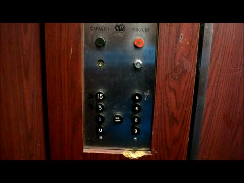 TATTERED VINTAGE OTIS ELEVATOR IN OFFICE BUILDING