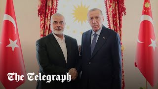 Erdogan shakes hands with Hamas leader Ismail Haniyeh
