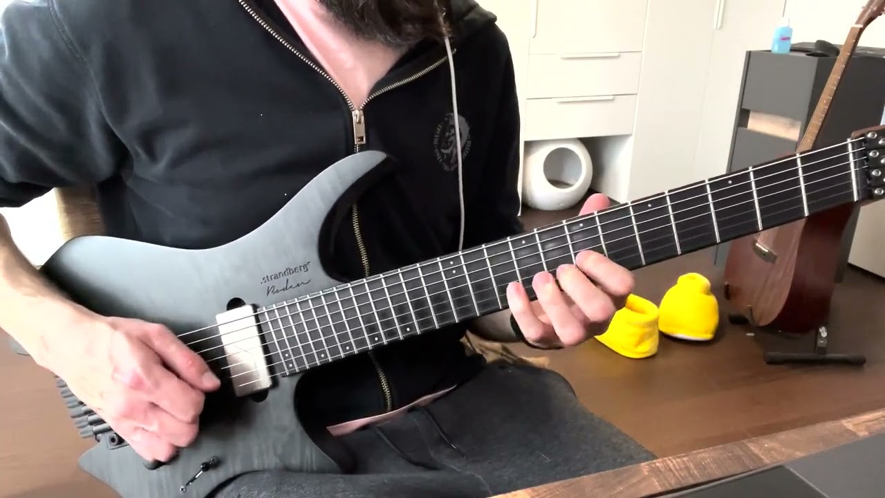 Roberto Barlocci playing a guitar exercise switching between sixteenth notes and triplets.