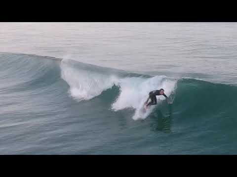 Aerial footage of small fun waves at Carlsbad