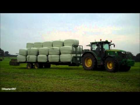 Baling, wrapping, stacking silage 2013, Cases with baler and wrapper, Deere with trailer and Loadall