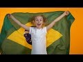 Adorable Preteen Girl Jumping With Brazilian Flag Cheering For Favorite Team Stock Footage