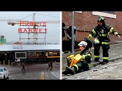 Caught on video: Seattle firefighters & pedestrians slide down slippery streets after ice storm