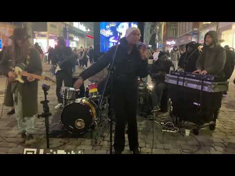 "ANOTHER DAY IN PARADISE" BY CAROL SINGS, WITH RUFF TRADE, BUSKING IN MANCHESTER  24/1/26