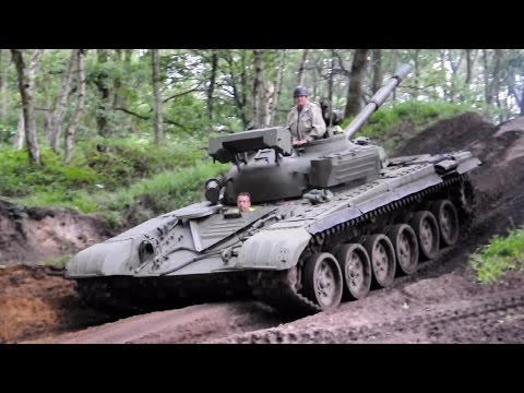 Russian T-72 tank driving in the forest