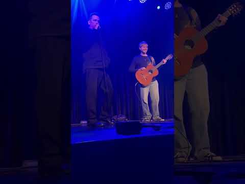 Mark Kozelek of Sun Kil Moon gives precious guitar lesson from stage.