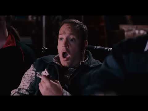 Official trailer still for Here Comes the Boom showing Kevin James entering the octagon under bright arena lights