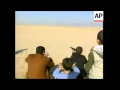 Video Of Qusay Teaching Son To Shoot