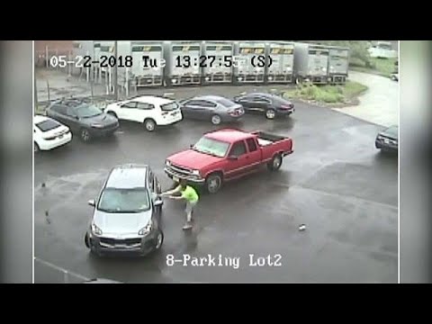 Driver caught on camera attacking another vehicle and passenger with a sledgehammer