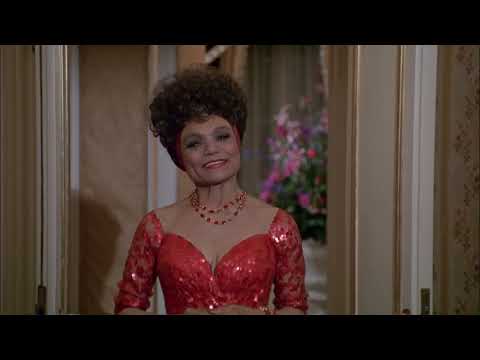 Trailer frame: upscale party with dim lighting, matching the soundtrack’s new jack swing pulse