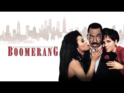 Trailer still: Eddie Murphy walking through a glassy corporate lobby, echoing the soundtrack’s polished R&B