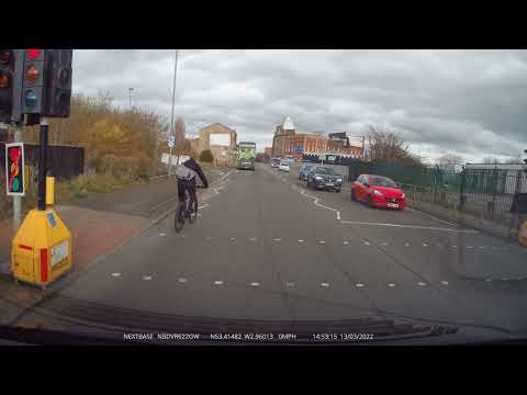 Dick head cyclist gives a vehicle the finger for getting too close then jumps a red light. Hypocrite