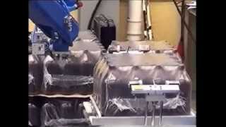 Motoman robot unwrapping bottles