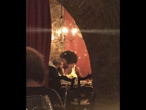 Tennis champ Serena Williams and rapper Drake kiss and cuddle at a Cincinnati restaurant