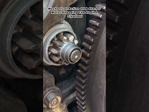 Mechanical Action Of A Starter Motor Engaging The Engine Flywheel
