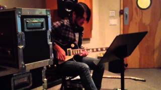 Andrew Synowiec plays guitar on "Kick Ass 2"