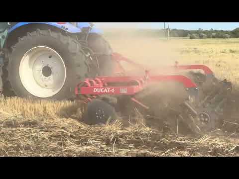 NEW HOLLAND T 6050 with DUCAT-4 mounted disc harrow. MINIMAL SOIL TILLAGE.