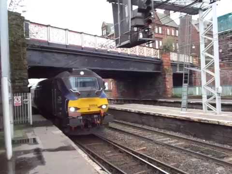 The Class 68 DRS No.68004 'Rapid' with “S.N.W.R.S.T.R. (Return Leg)” arriving at Carlisle.