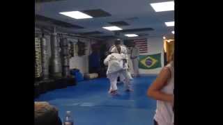 Jiu Jitsu girl flipping boy in the air
