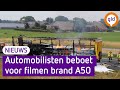 Politie deelt ruim 150 bonnen uit voor filmen vrachtwagenbrand op A50