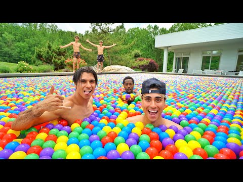 We Put 100,000 Rainbow Balls In Our Swimming Pool!